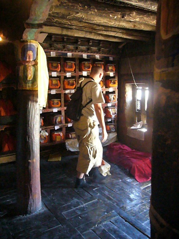 Clem finds that a monk is hidden under the red sheet.